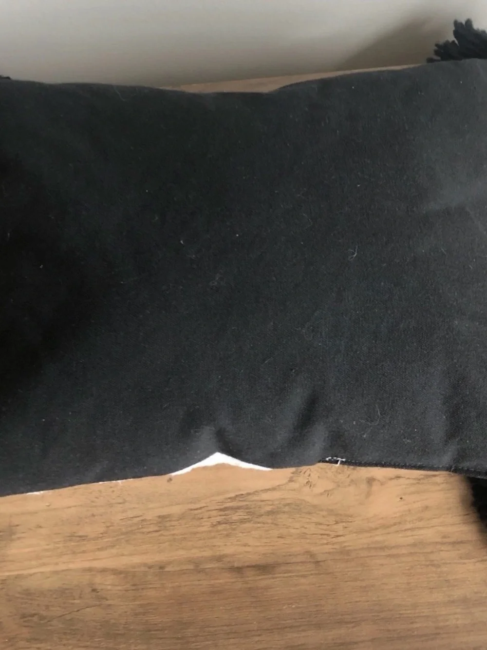 White Decorative Pillow with Black Script and Tassels